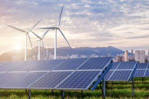 solar panels in front of wind mills